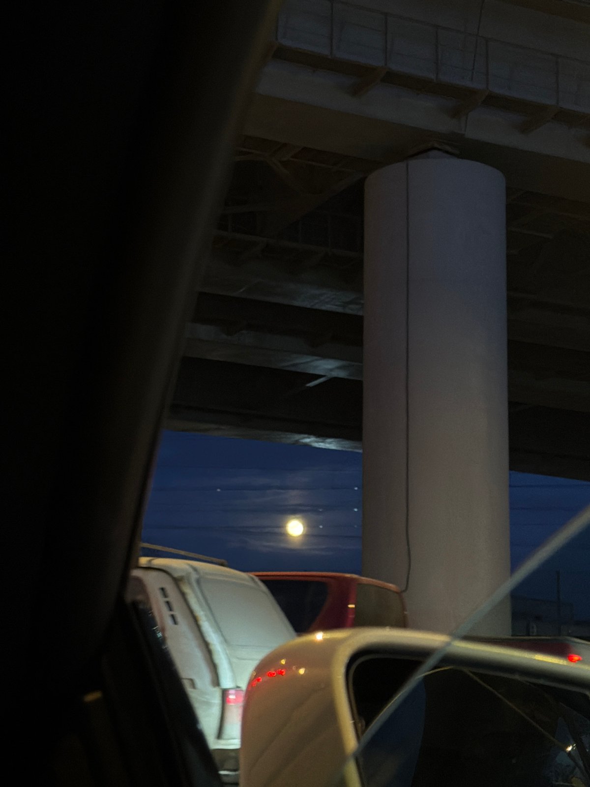 White van parked under bridge in Moscow