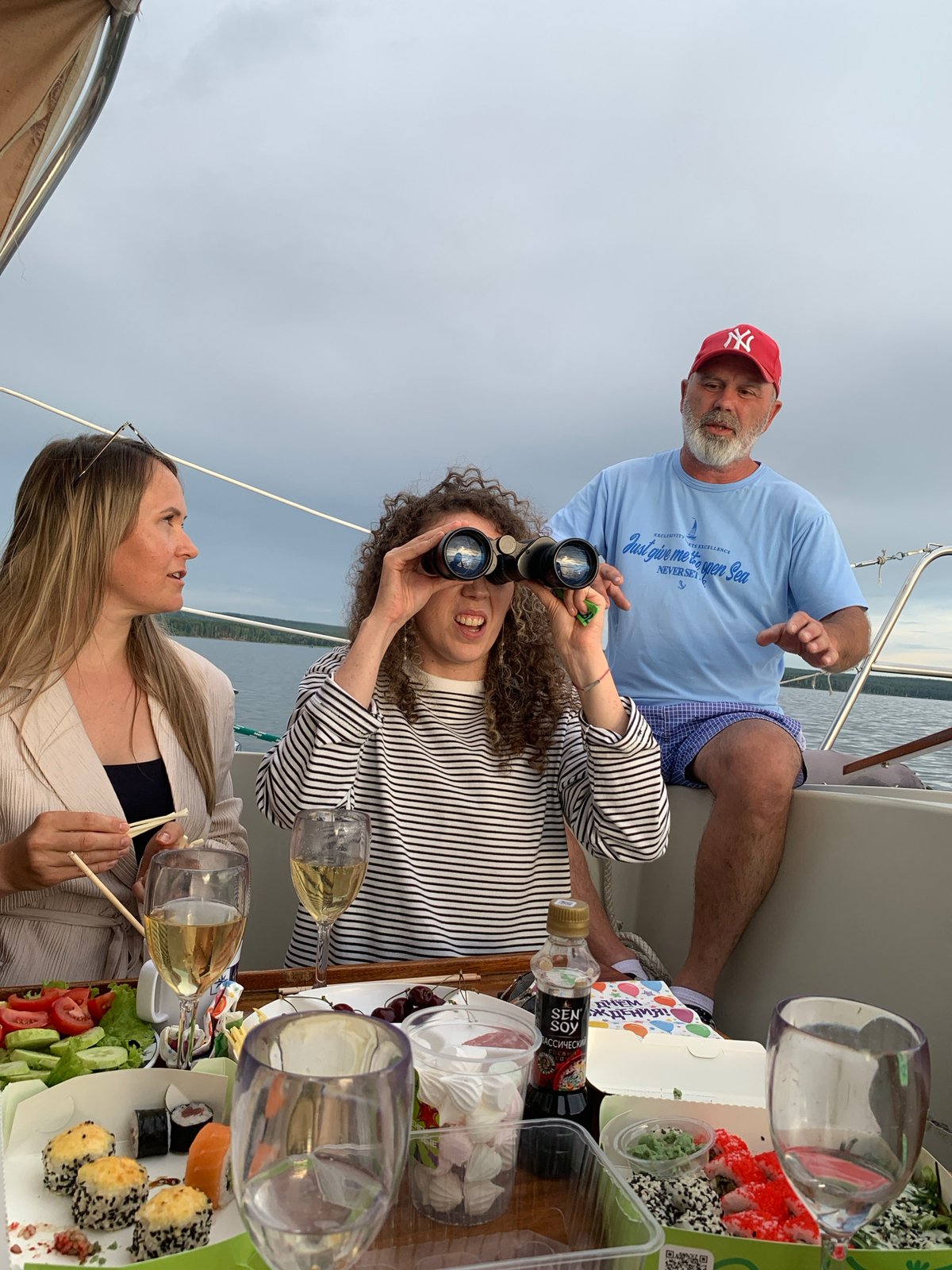 Sailboat afternoon on the Kama River with sushi and rosé