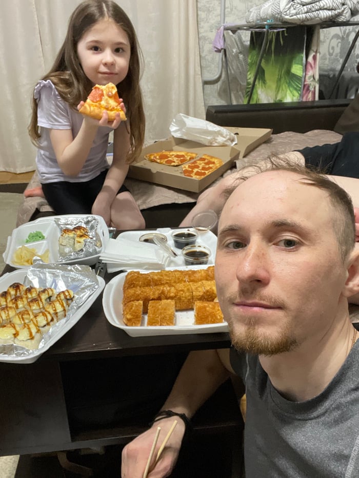 Family meal shared in domestic setting in Лубянки, Russia