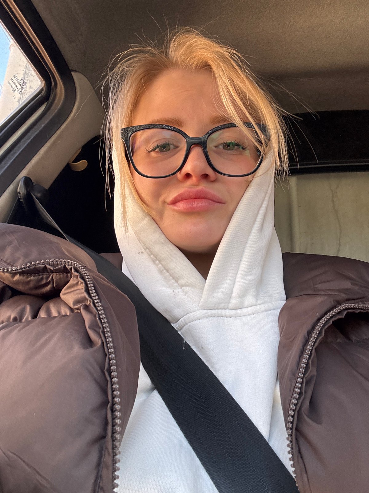 Woman in winter clothing observed in vehicle, Saint Petersburg