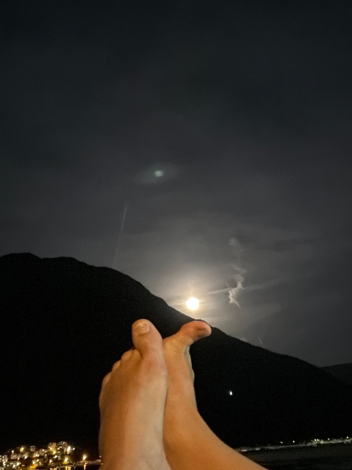 Couple enjoys moonlit evening on Bay of Kotor waterfront