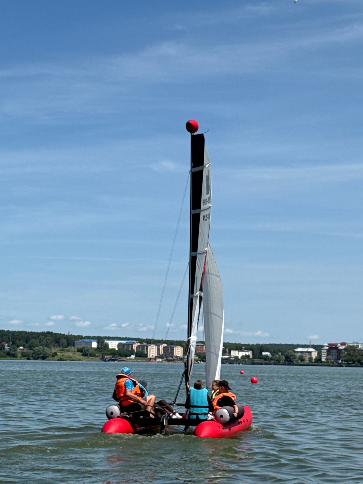 Sailboats and paddleboards out on a Votkinsk lake