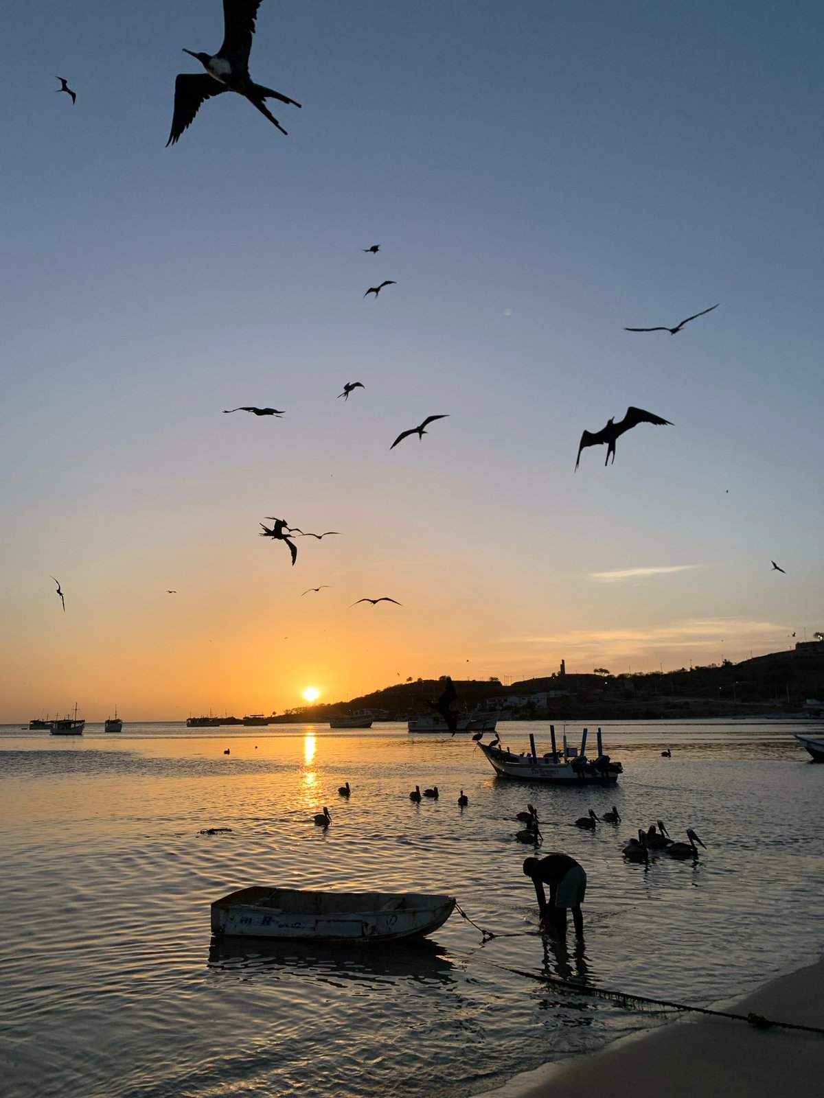 Evening sunset documented across Juan Griego, Venezuela harbor and streets