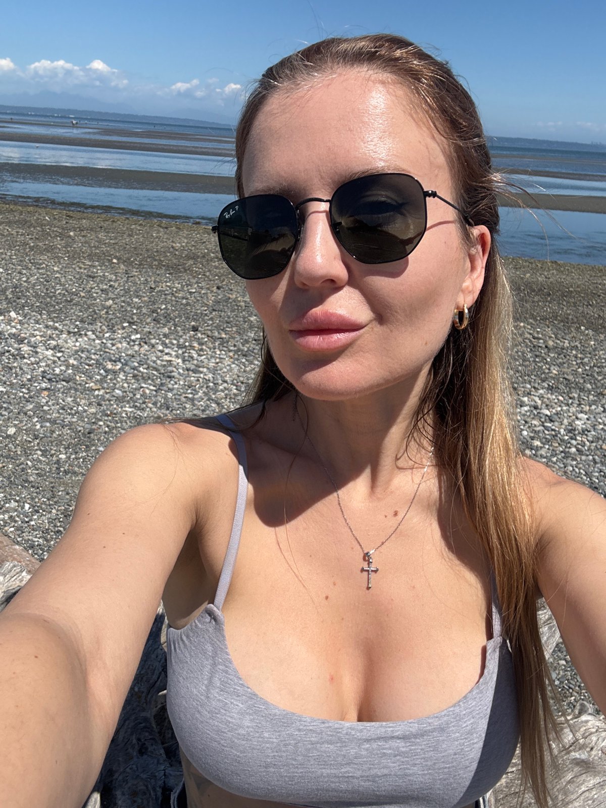 Selfie on a calm pebble beach in Delta, Canada
