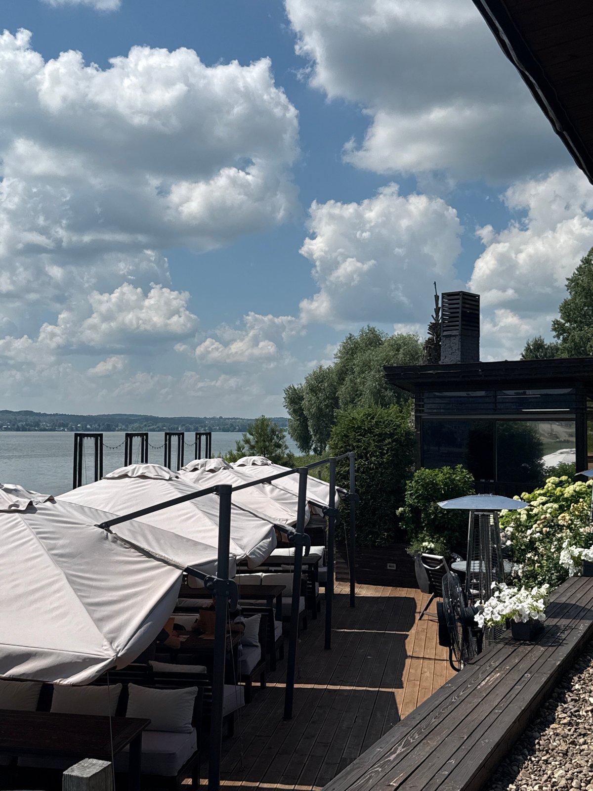 Lakeside café deck and pier on a calm Votkinsk morning
