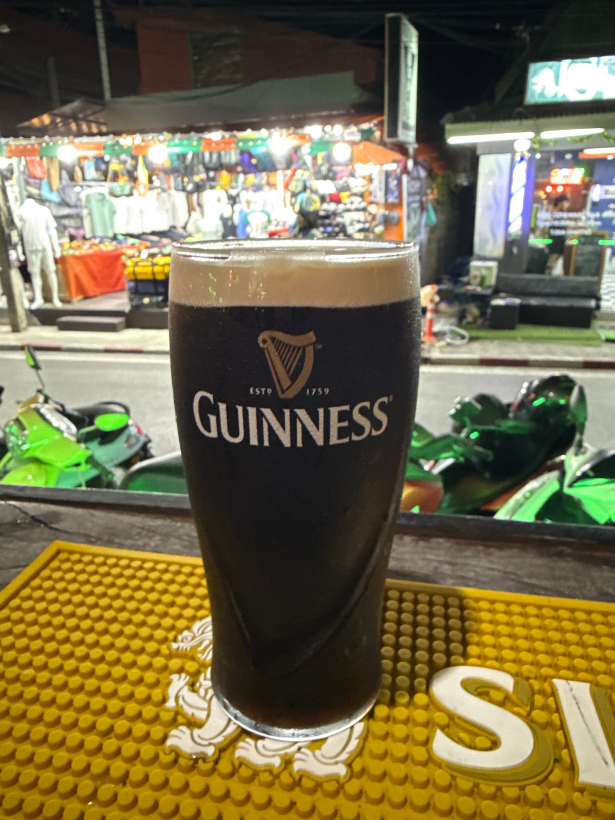 Guinness beer spotted on decorative bar mat in Thailand