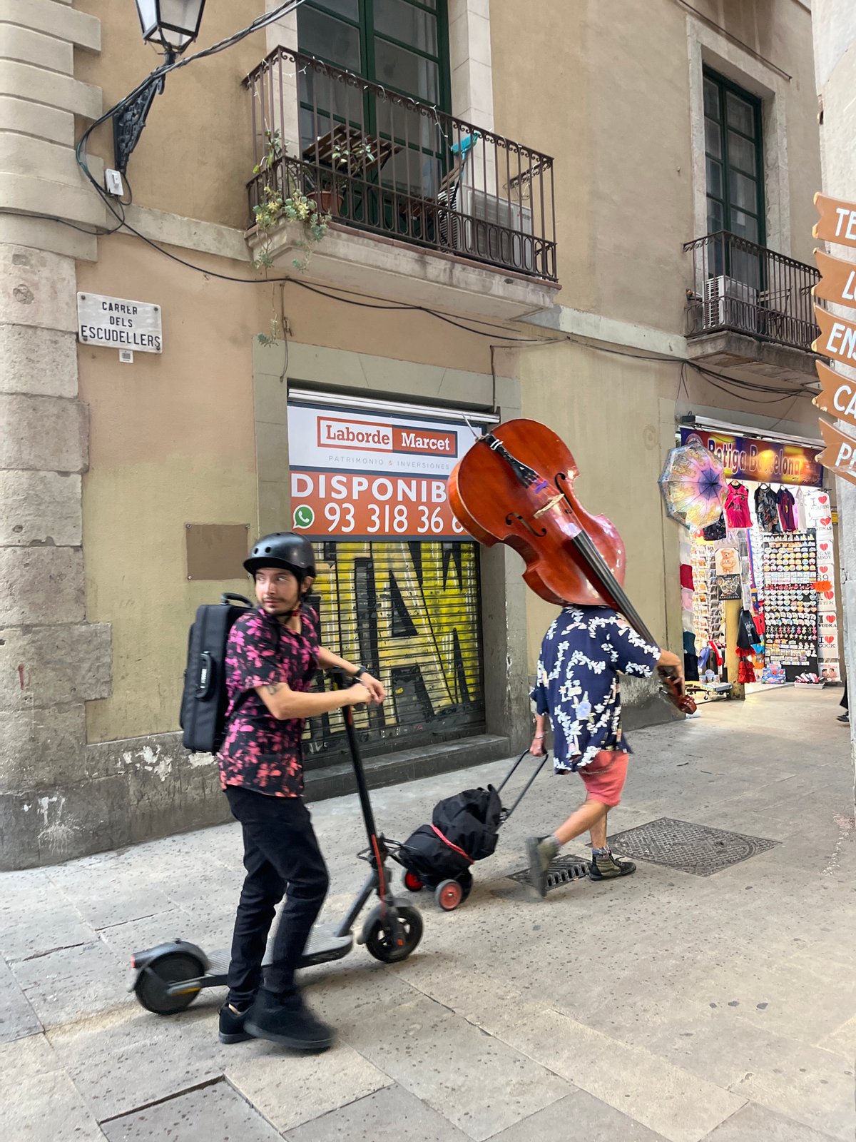 Two men pose for cameras on Barcelona streets