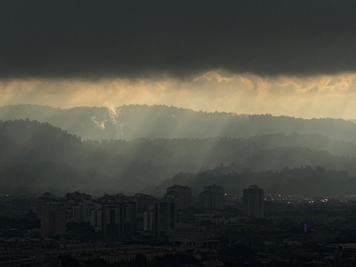 Hazy conditions blanket Kuala Lumpur skyline early morning