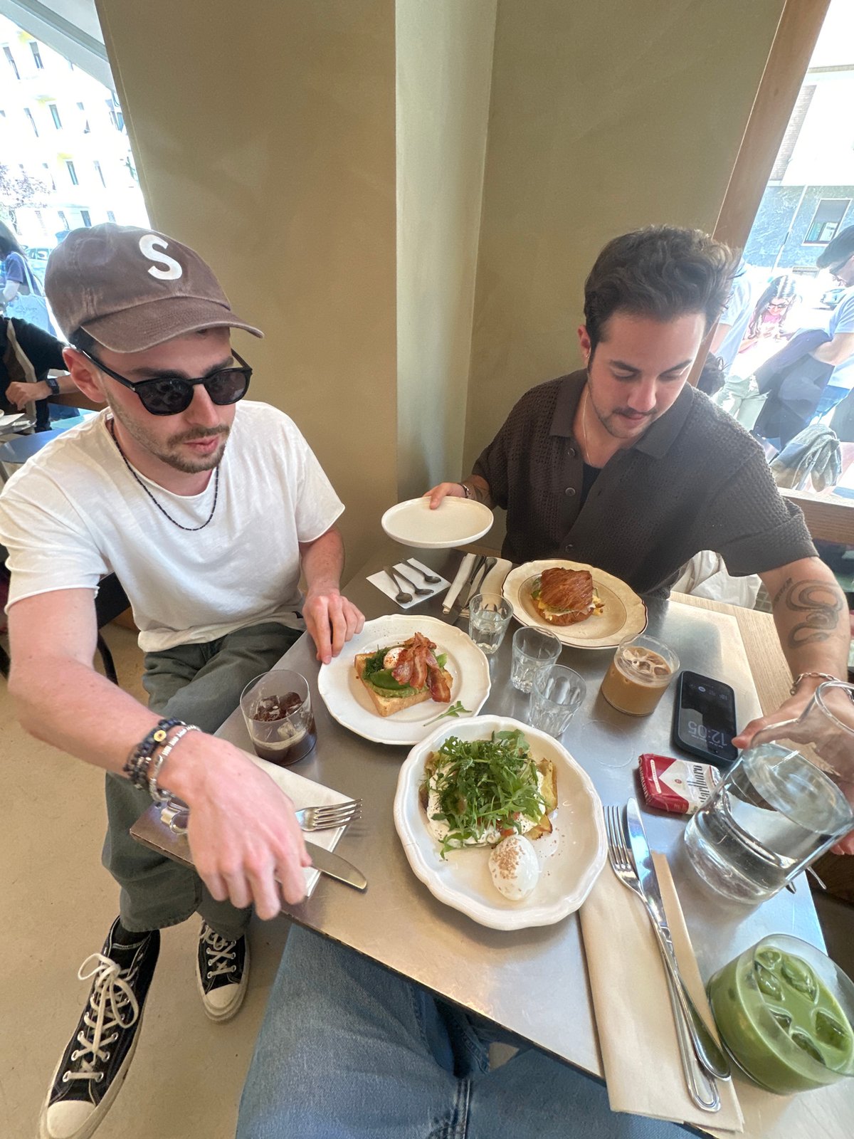 Two men share breakfast meal in Milan