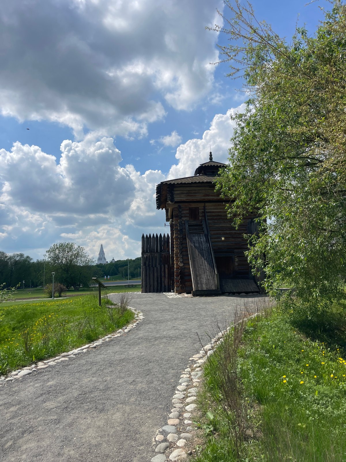 Group walks through Moscow's Kolomenskoye Park on spring morning
