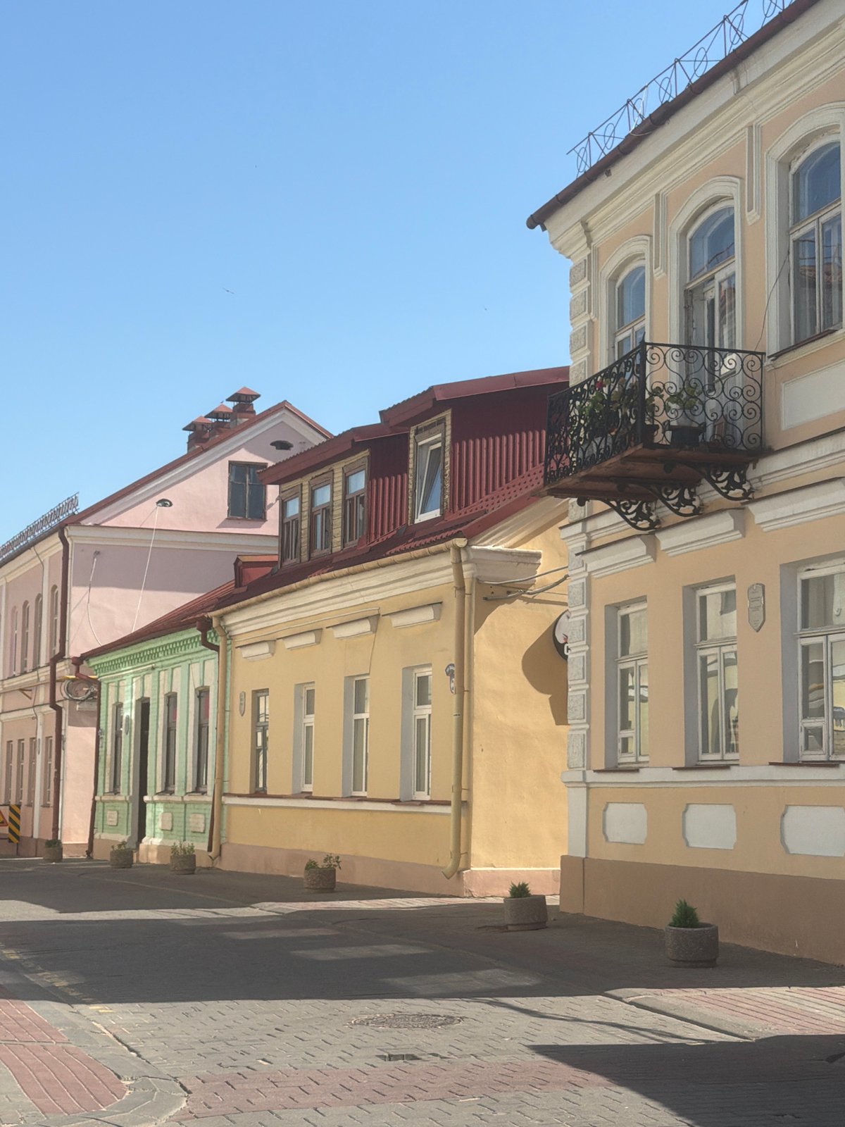 Street-level views of European-style architecture and cobblestone streets