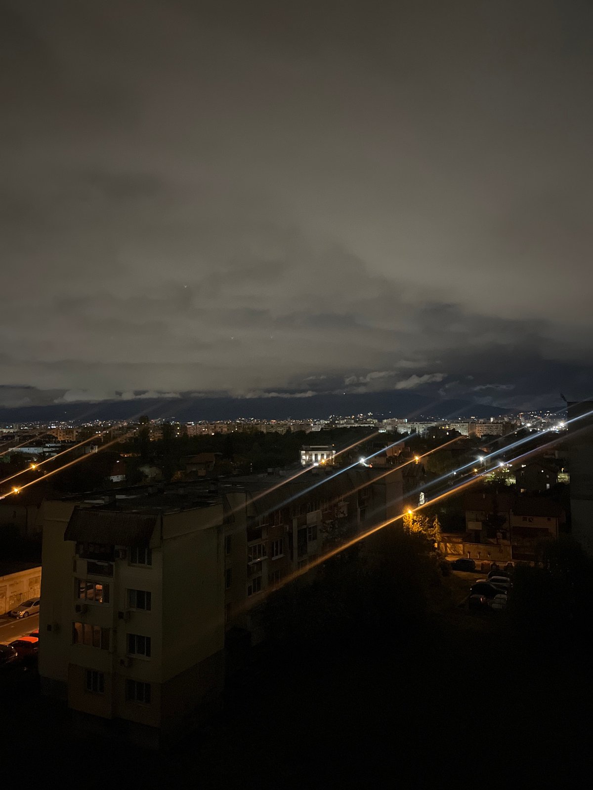 Witness captures nighttime panoramic view of cloudy Sofia skyline