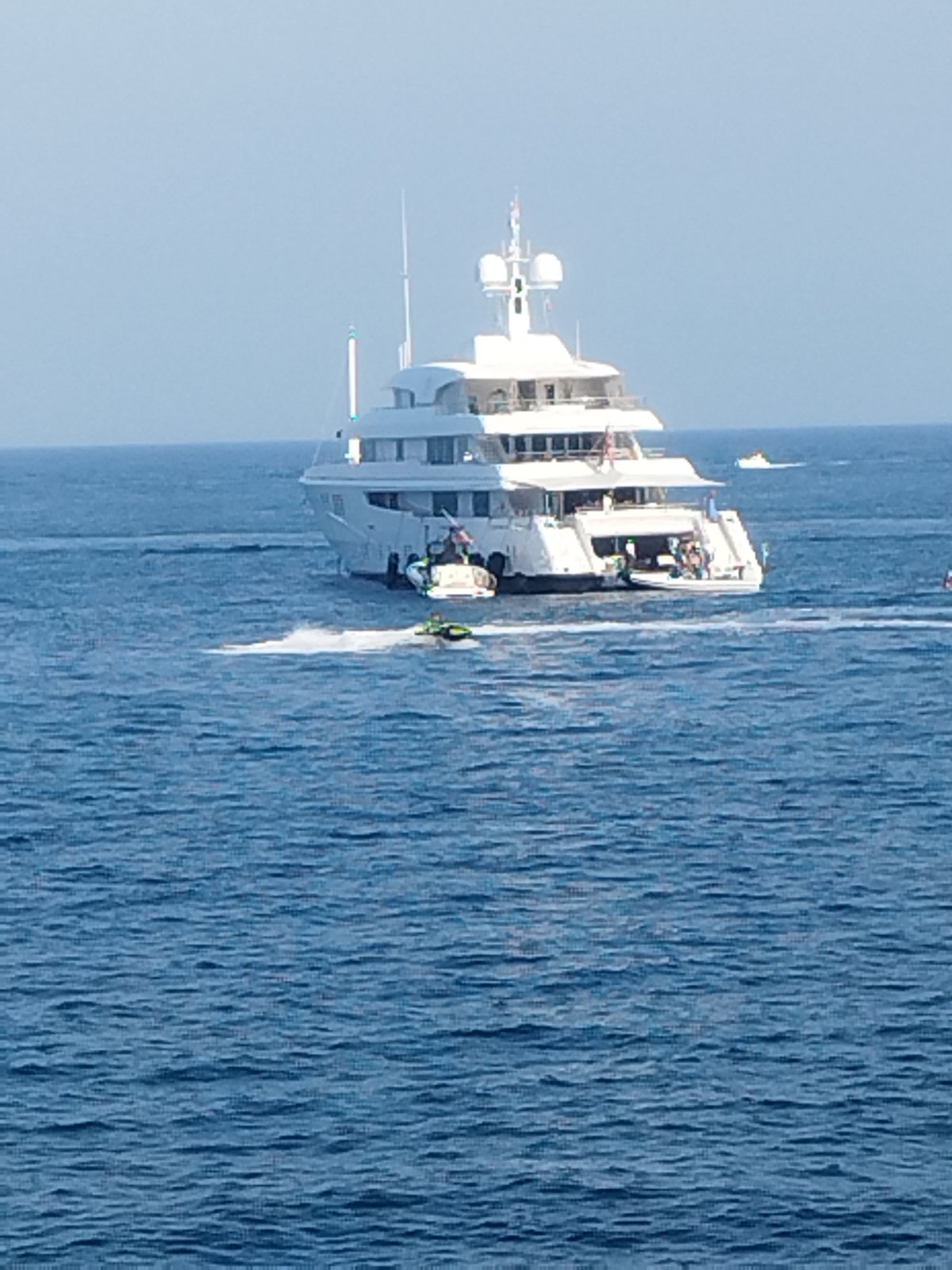 Cap d'Antibes coast busy with yachts, boats, and shoreline activity