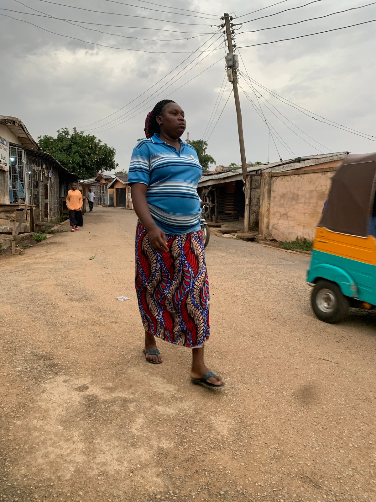 Daily life unfolds on Jos streets during afternoon hours