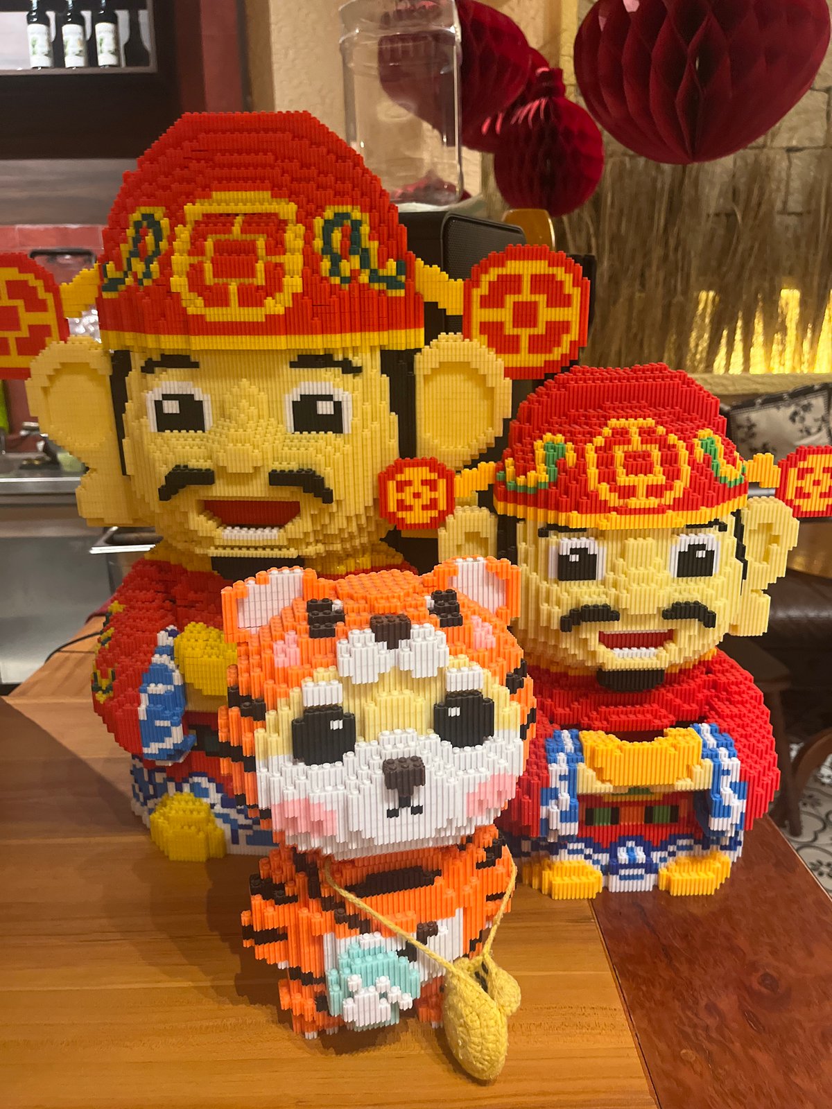 Nha Trang night: beach volleyball, moon, and brick tiger figurines