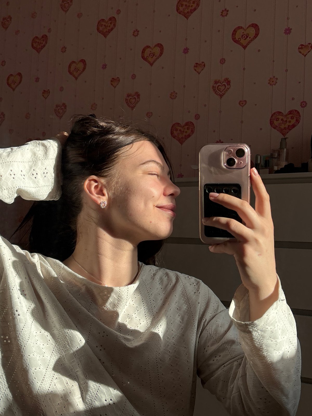 Woman photographed with smartphone in Perm interior spaces
