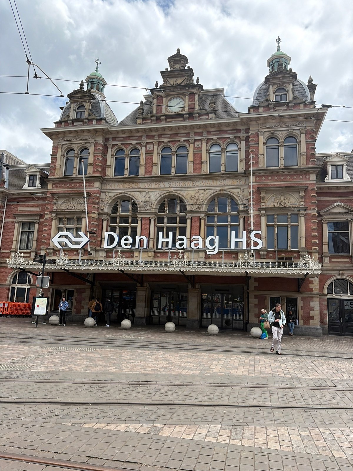 Tourist documentation captures The Hague's architectural contrasts near central station