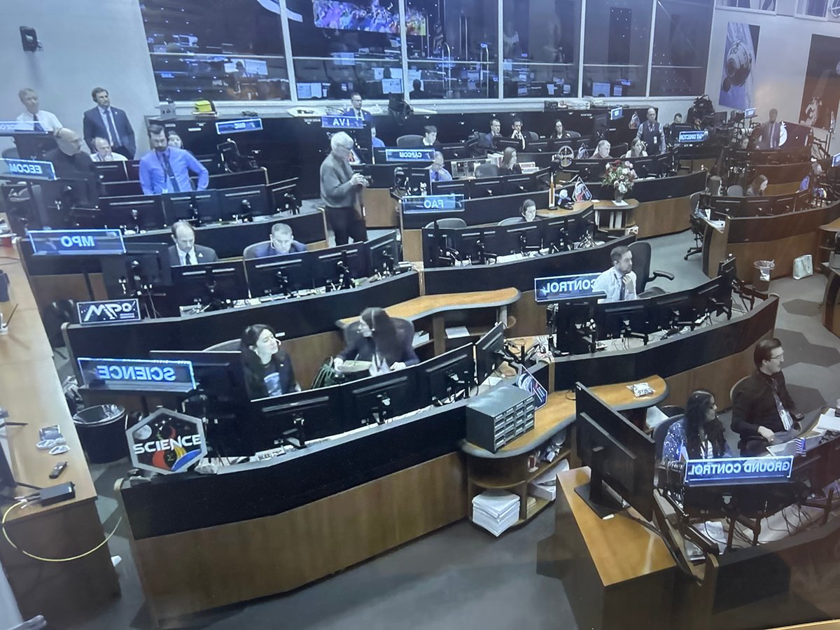 Control room with tiered stations operational during evening hours