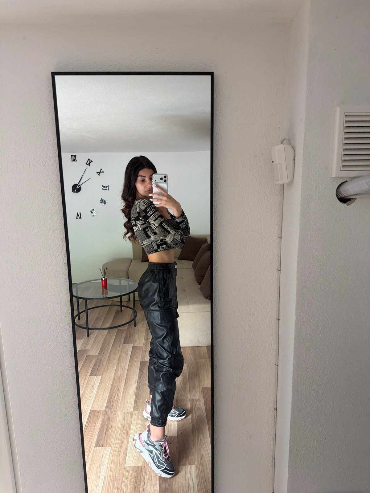 Woman takes mirror selfies in Gabrovo, Bulgaria morning