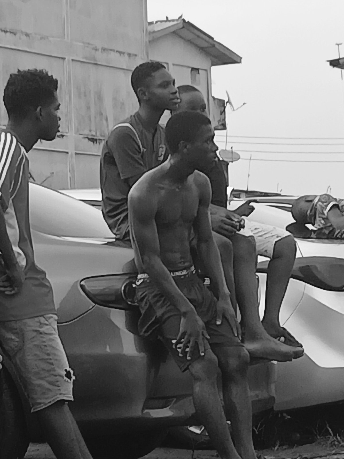 Young men play street soccer in Lagos residential area