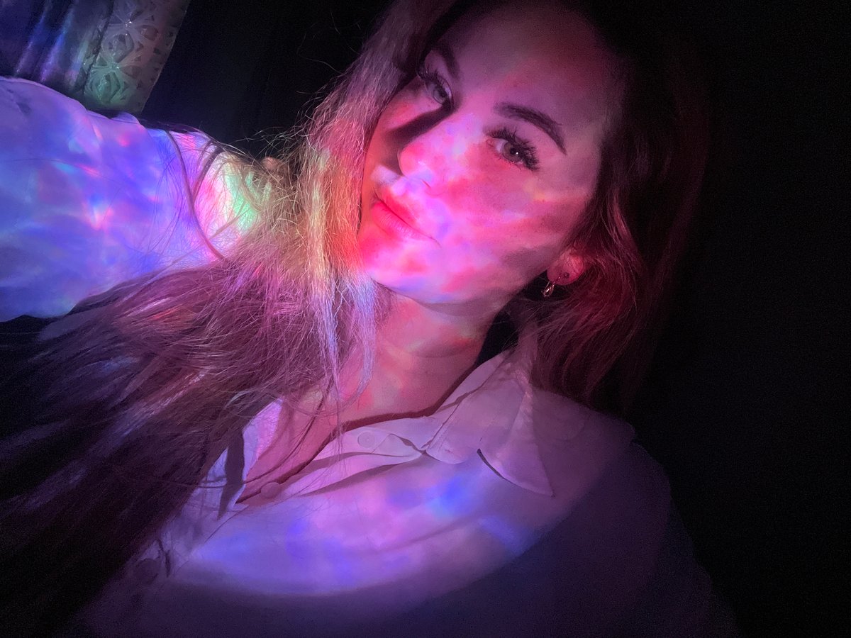 Woman photographed in colored lighting portrait session in Chaikovsky