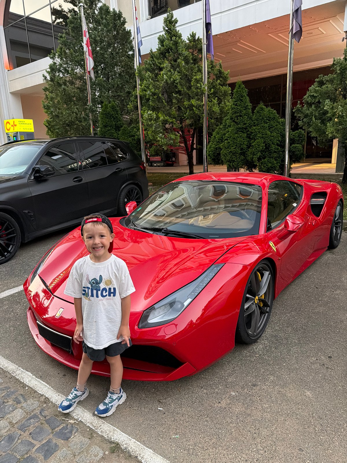Posing next to a red Ferrari in Batumi, Georgia