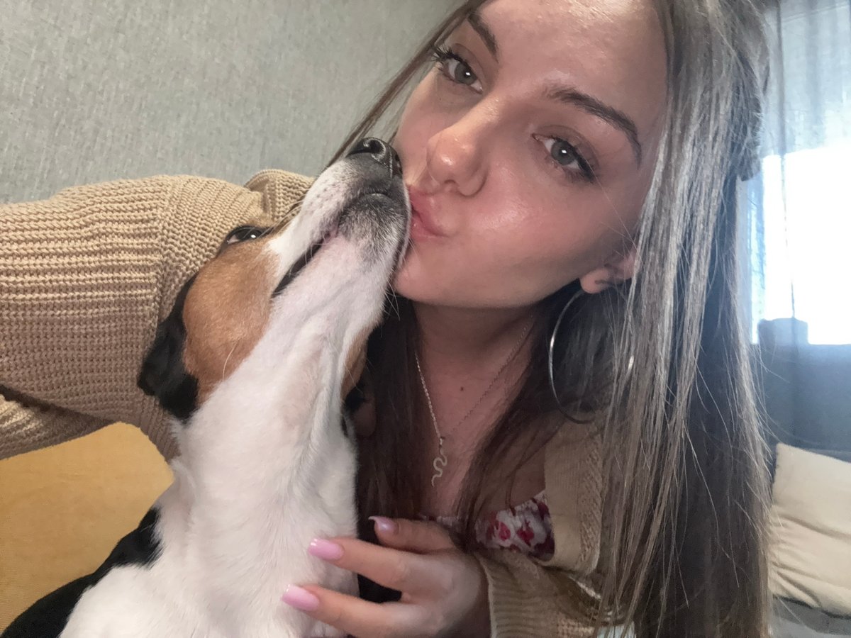 Woman photographs playful moments with Jack Russell Terrier in Sofia