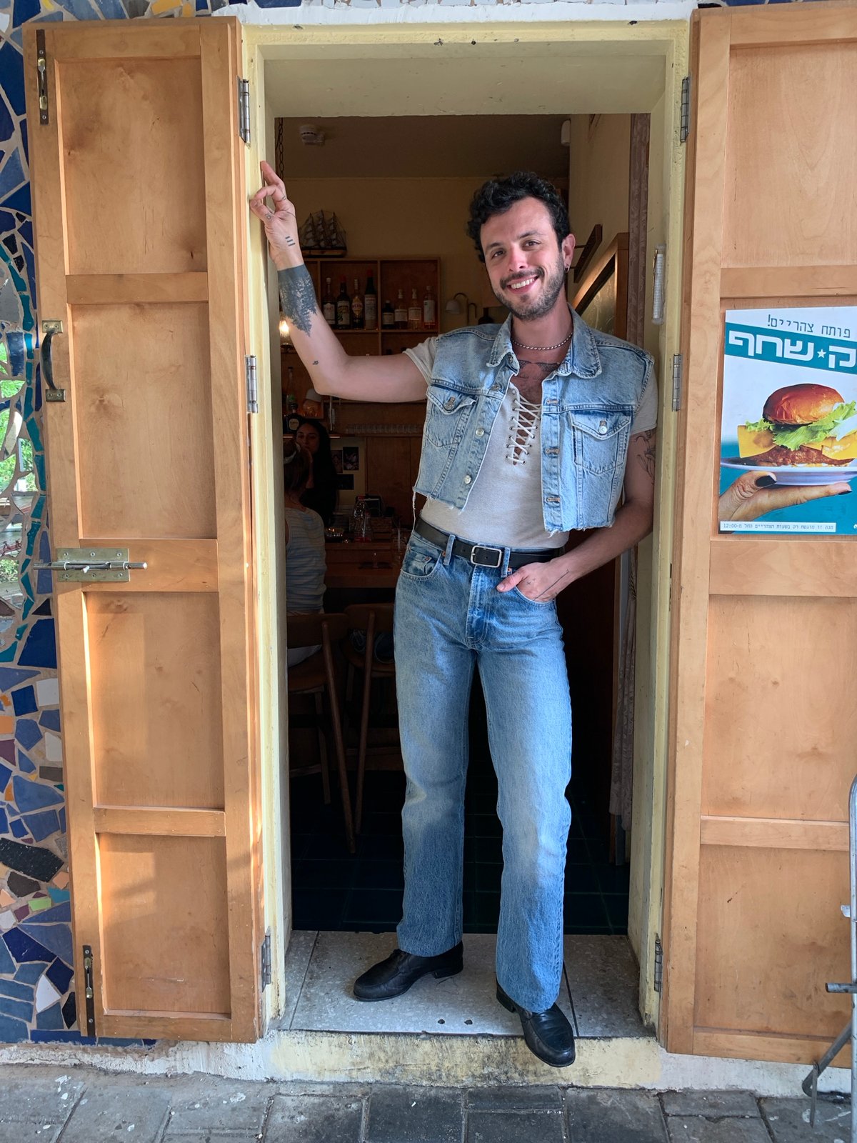 Man in denim outfit spotted in Tel Aviv doorway