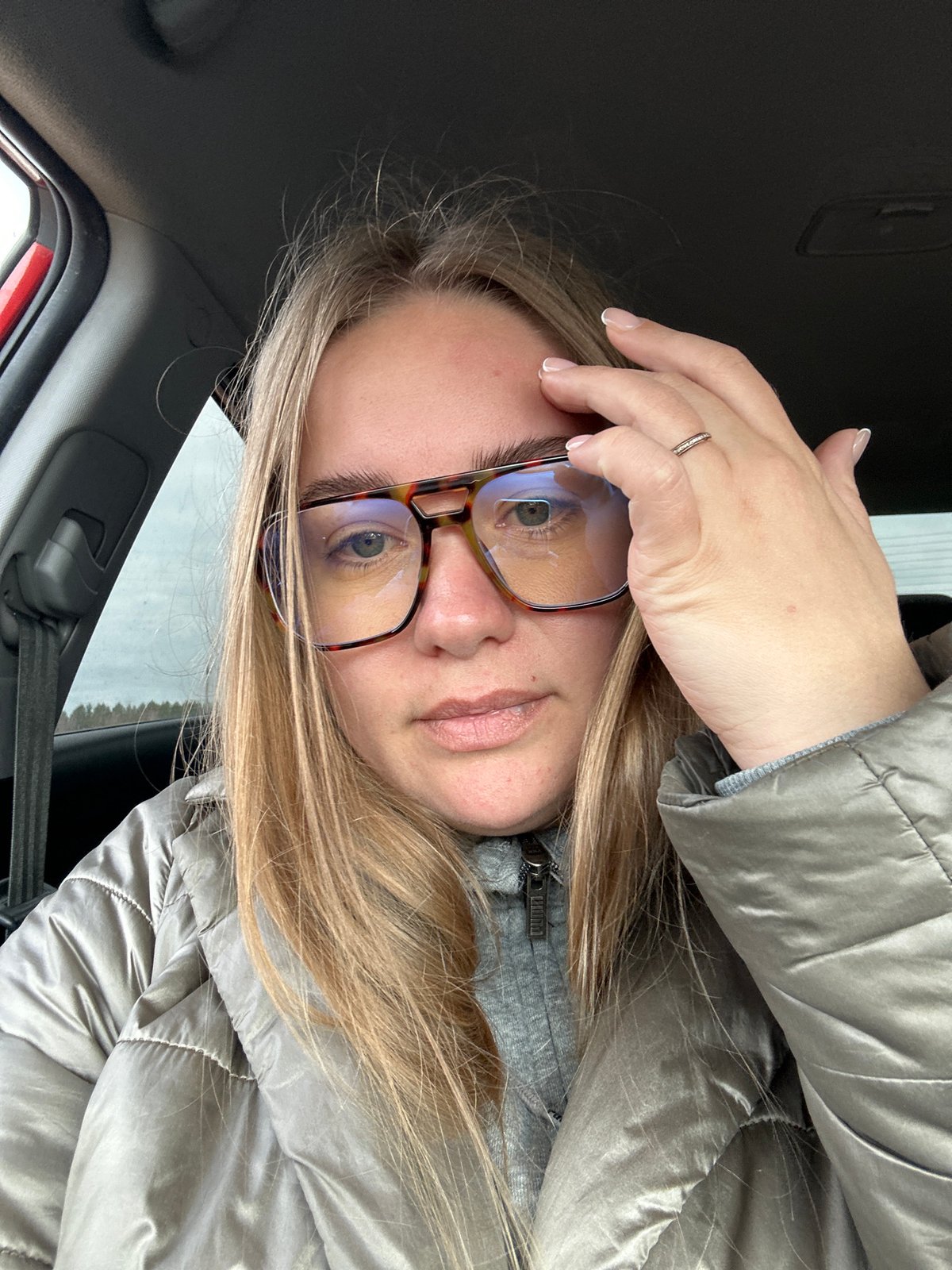 Person takes selfie in vehicle in Ural'skoe, Russia
