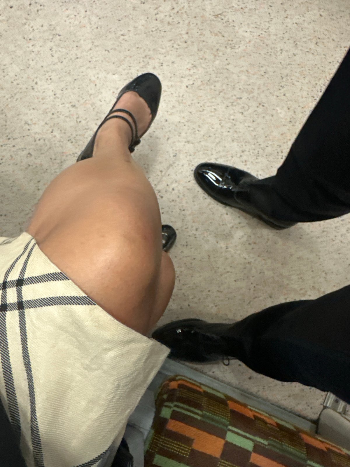 Two people spotted indoors with sofa in London