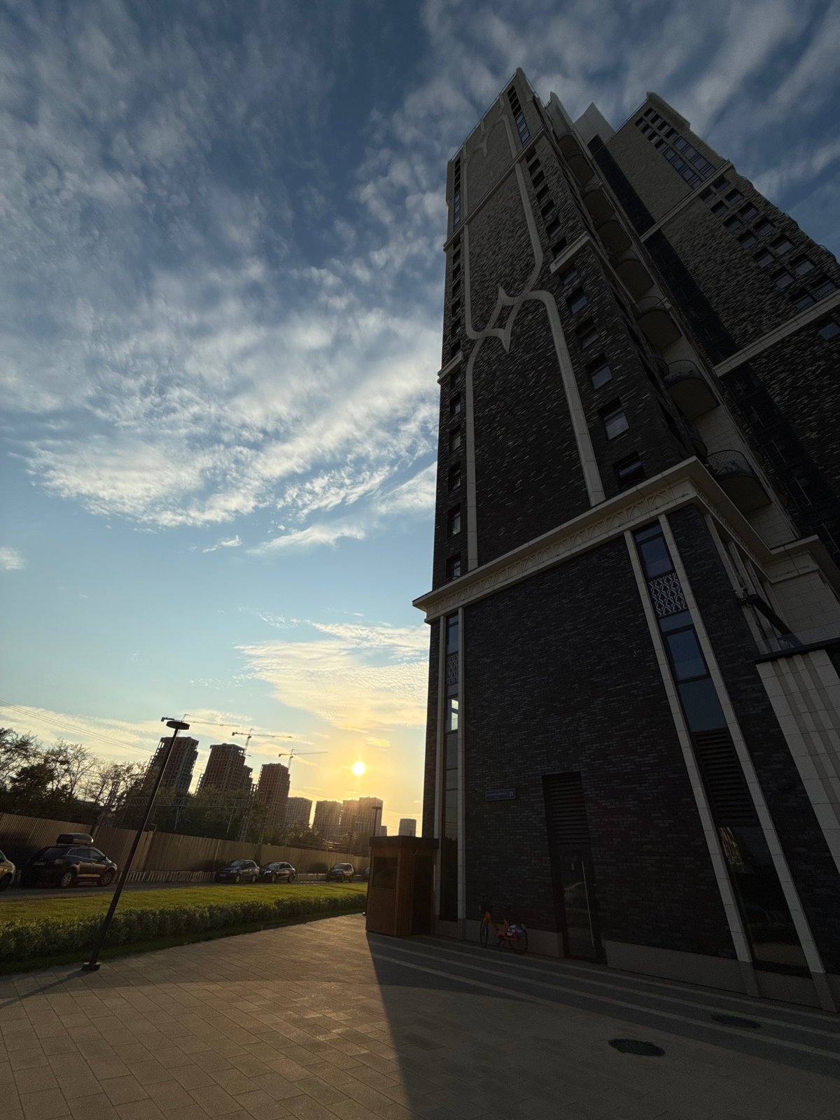 Urban journey through modern cityscape documented during sunset hours
