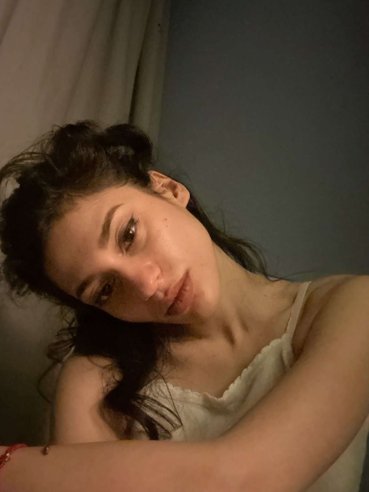 Woman documents evening photo session with pet in Sofia