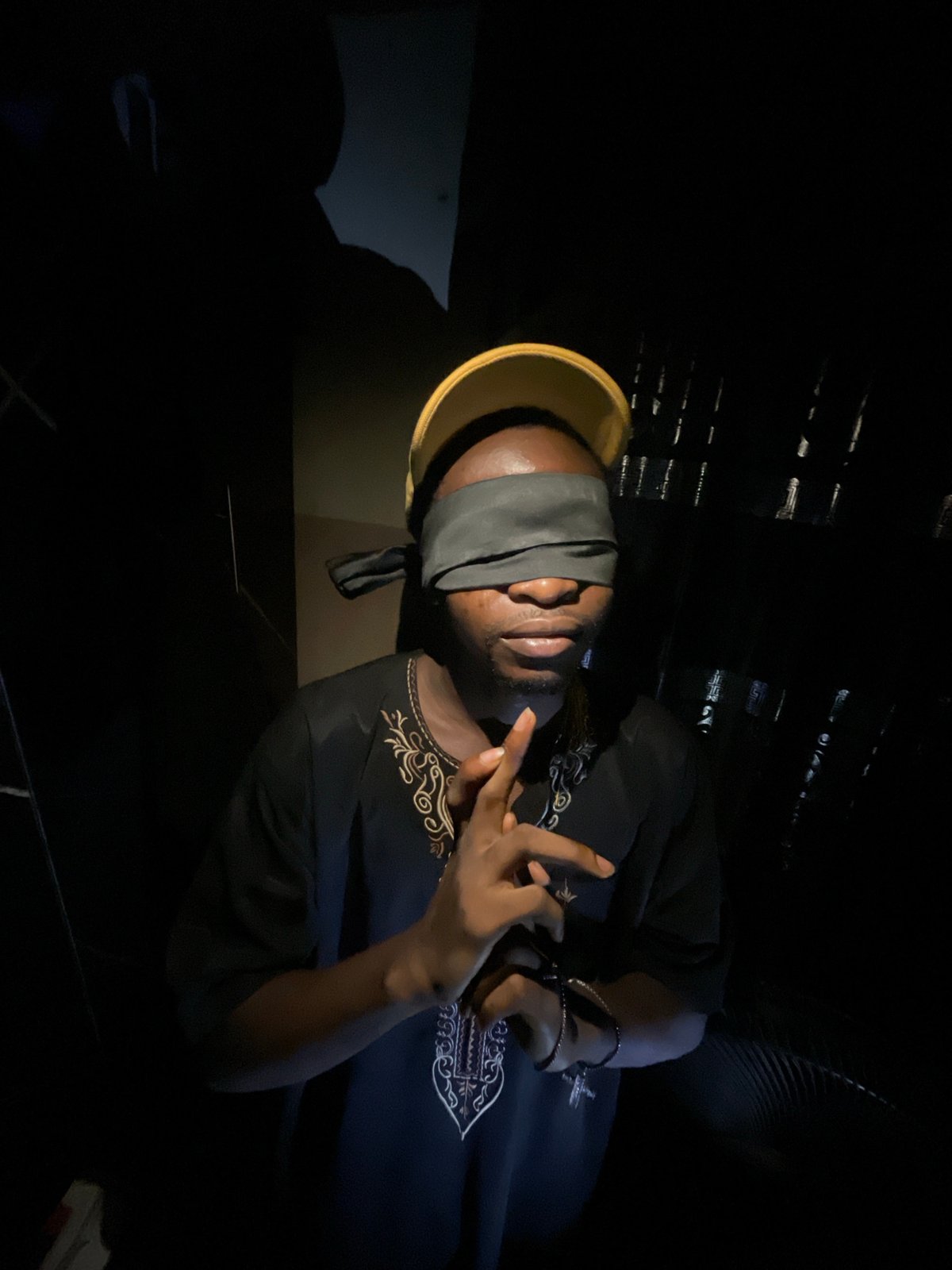 Blindfolded man photographed multiple times in Lokoja, Nigeria