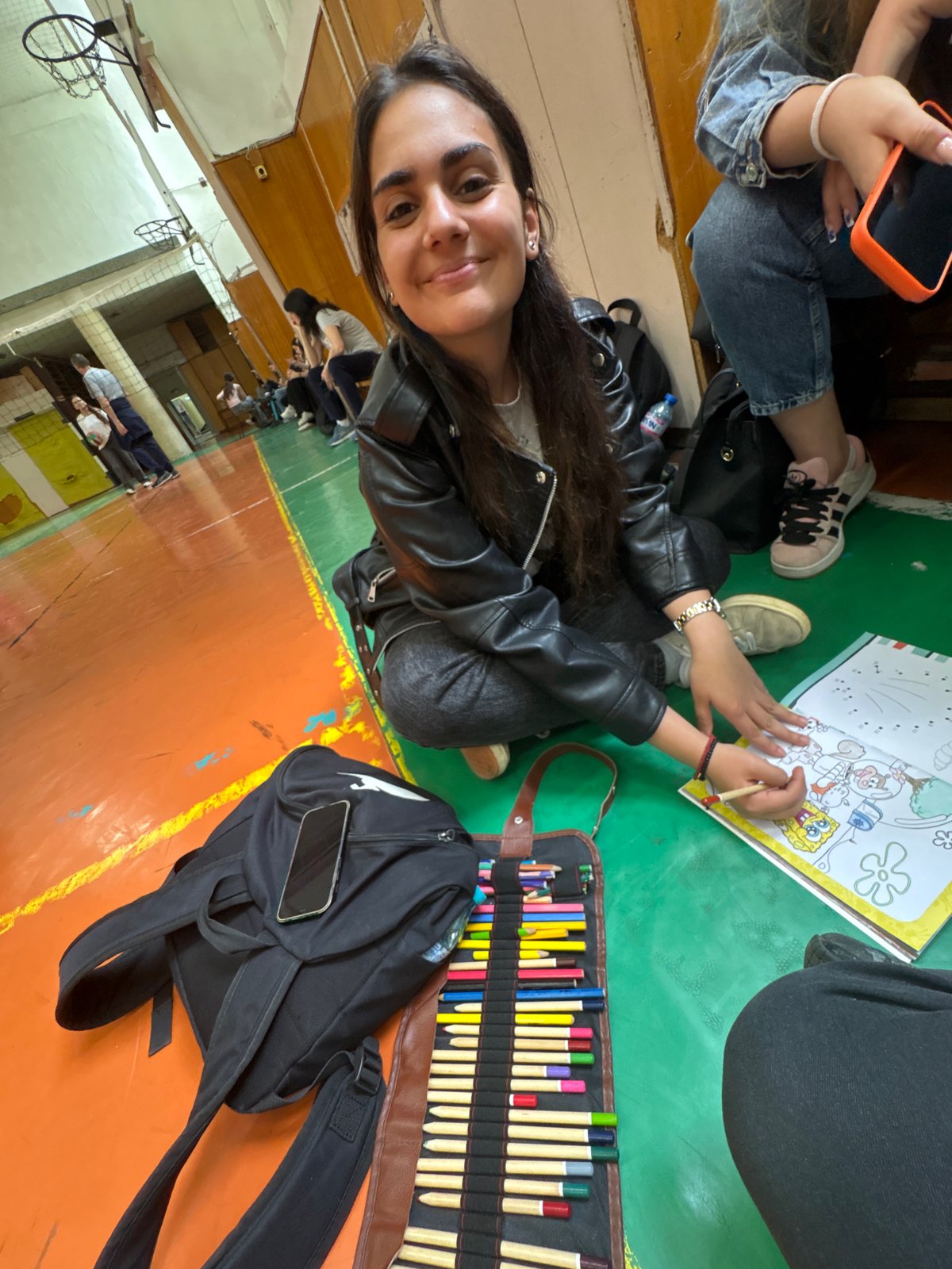 Student colors SpongeBob books, studies Spanish in Burgas classroom