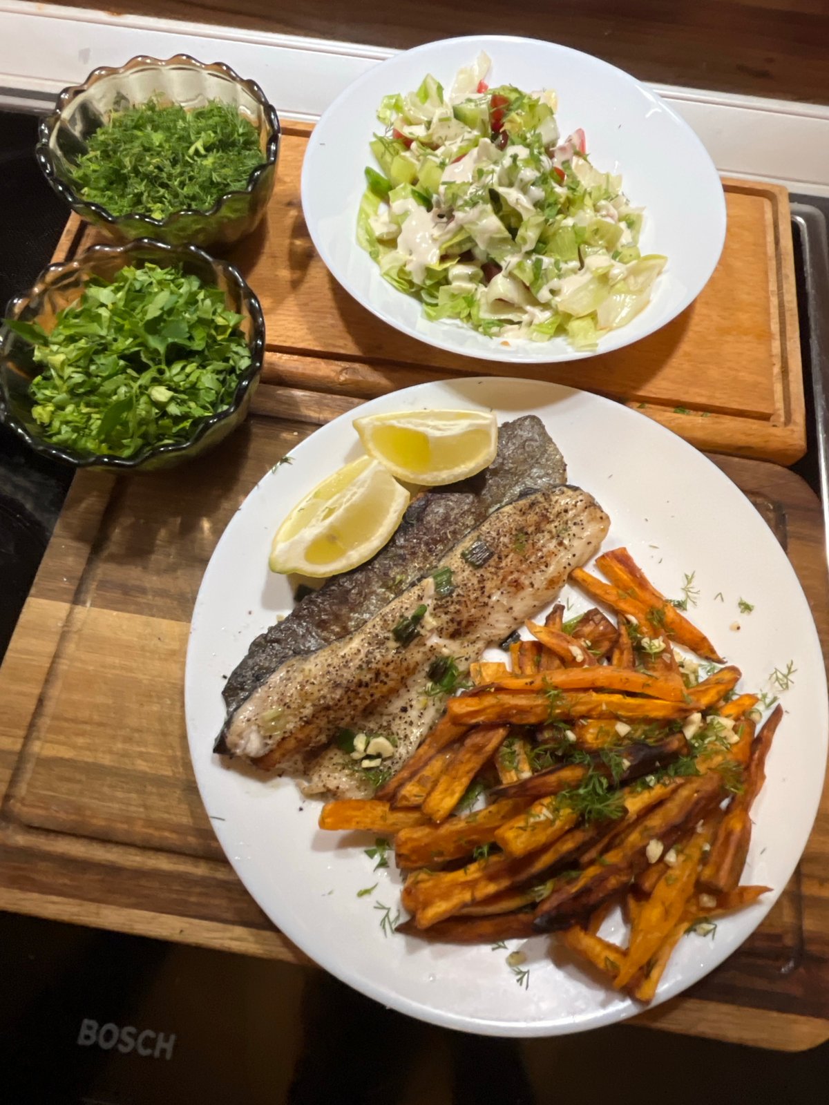 Evening meal preparation with fish and herbs in Sofia