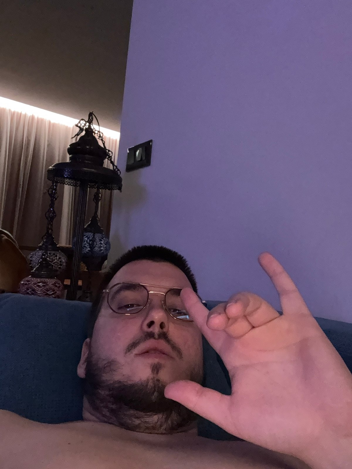 Man Makes Casual Hand Gesture Indoors in Sofia
