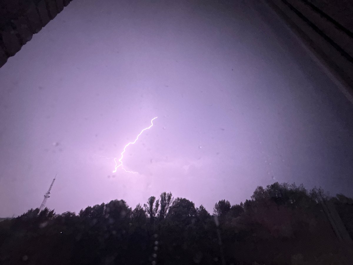 Summer lightning storm over Oskemen with a comms tower nearby