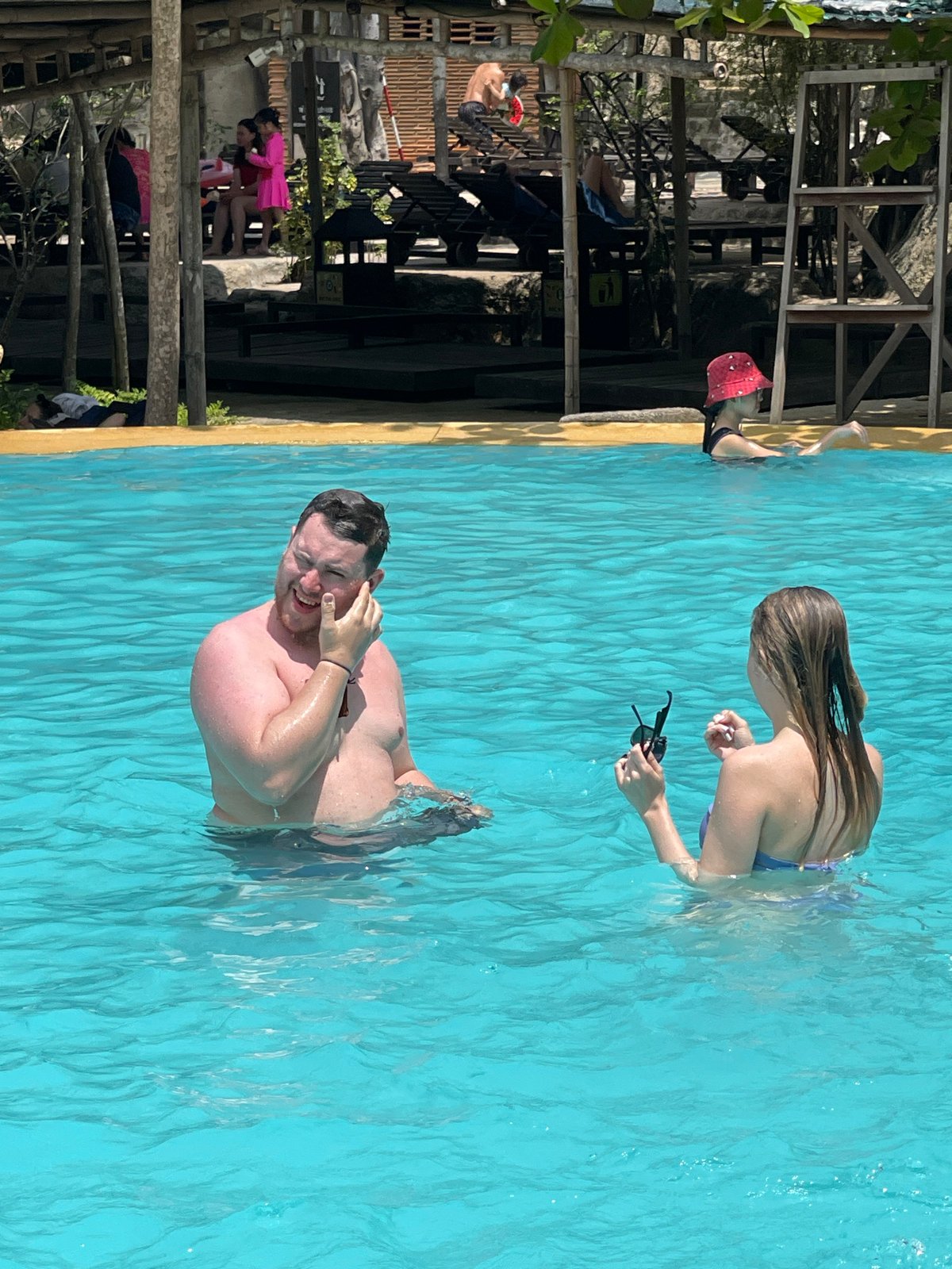 Morning scenes from Nha Trang: poolside couple, blooming heritage trail