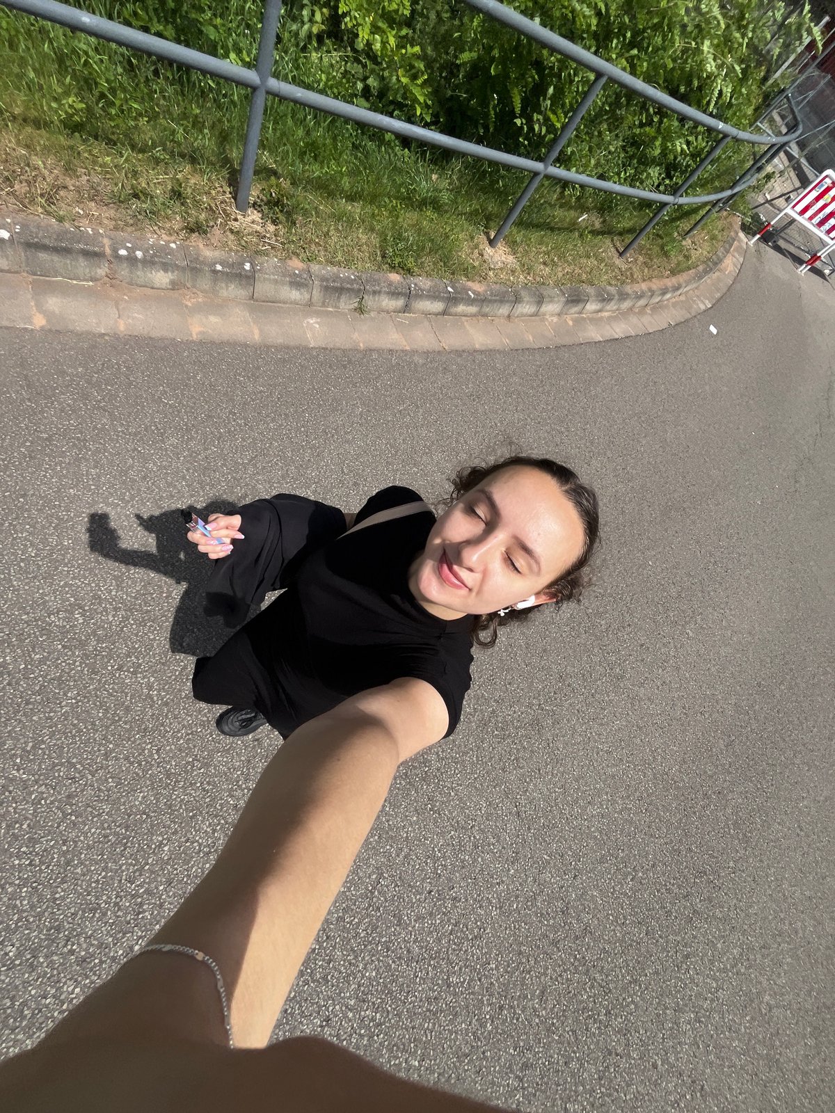 Woman takes selfie on street in Saarbrücken