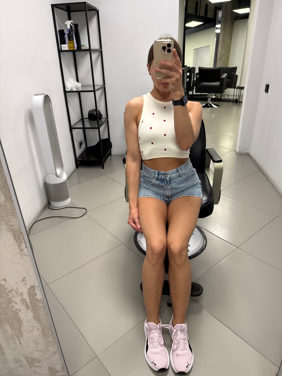 Woman takes salon selfies in Saint Petersburg hair salon
