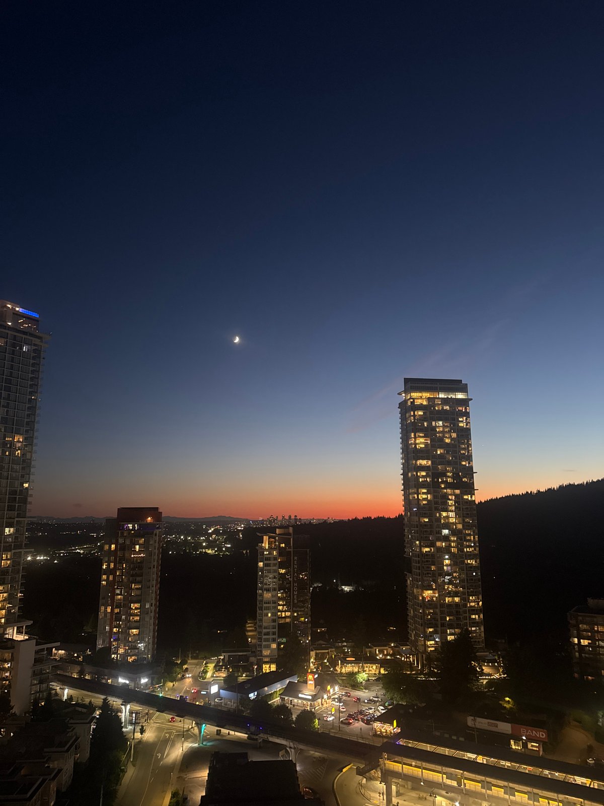 Coquitlam skyline glows as daylight fades to night