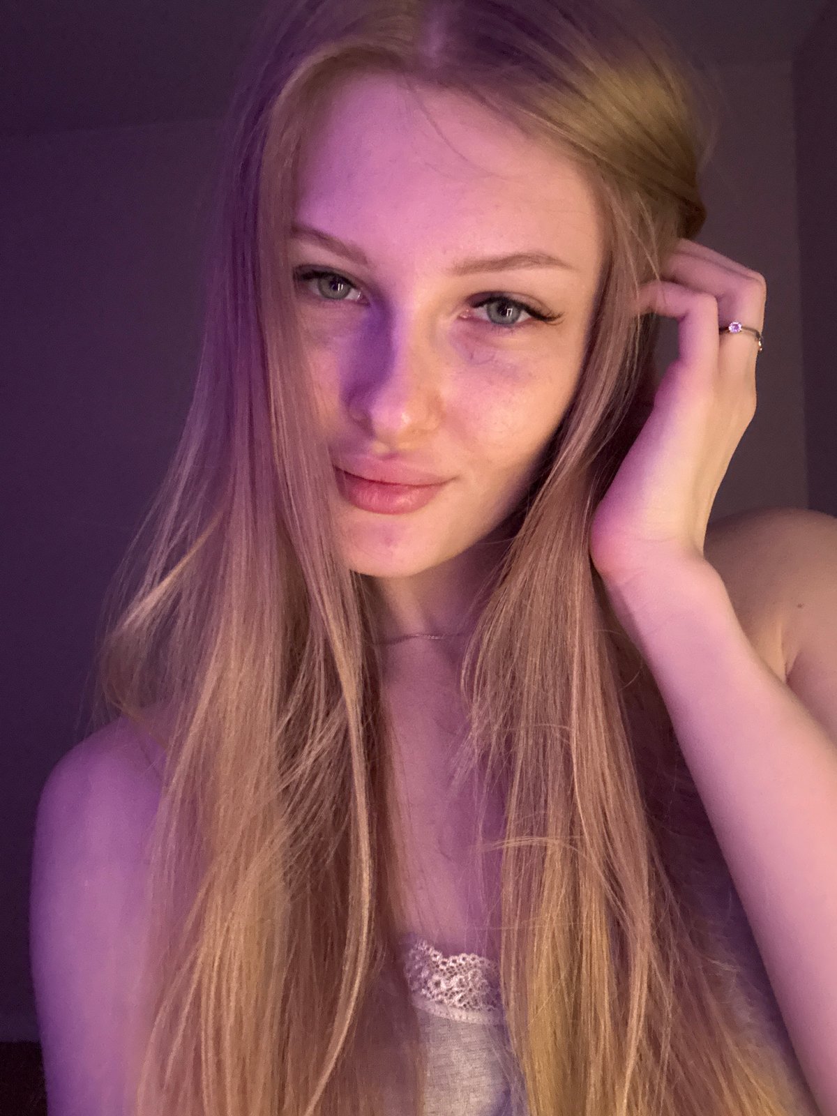 Portrait photos taken under purple lighting in Perm