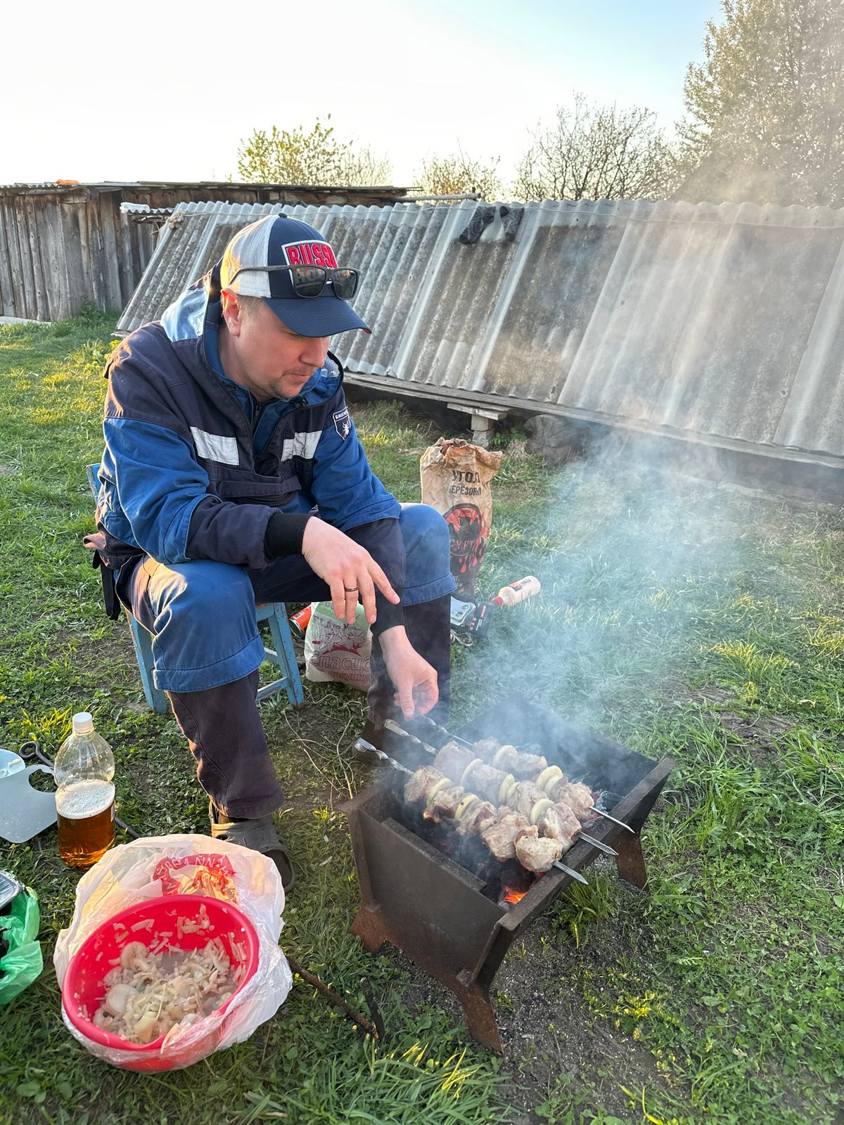 Family barbecue gathering documented in rural Russian village