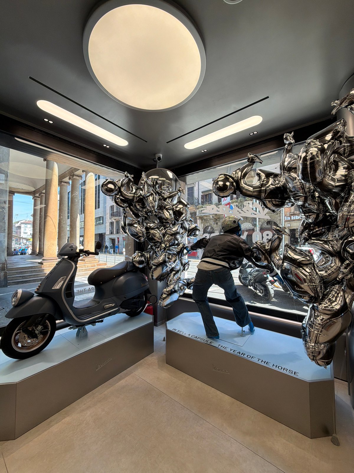 Vespa store display and tradition hashtag documented