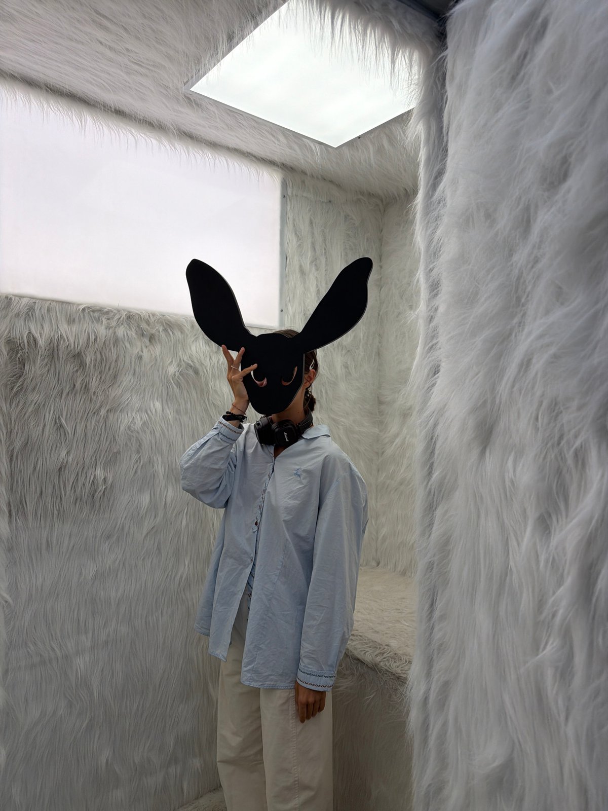 Visitors explore white fur installation in Saint Petersburg