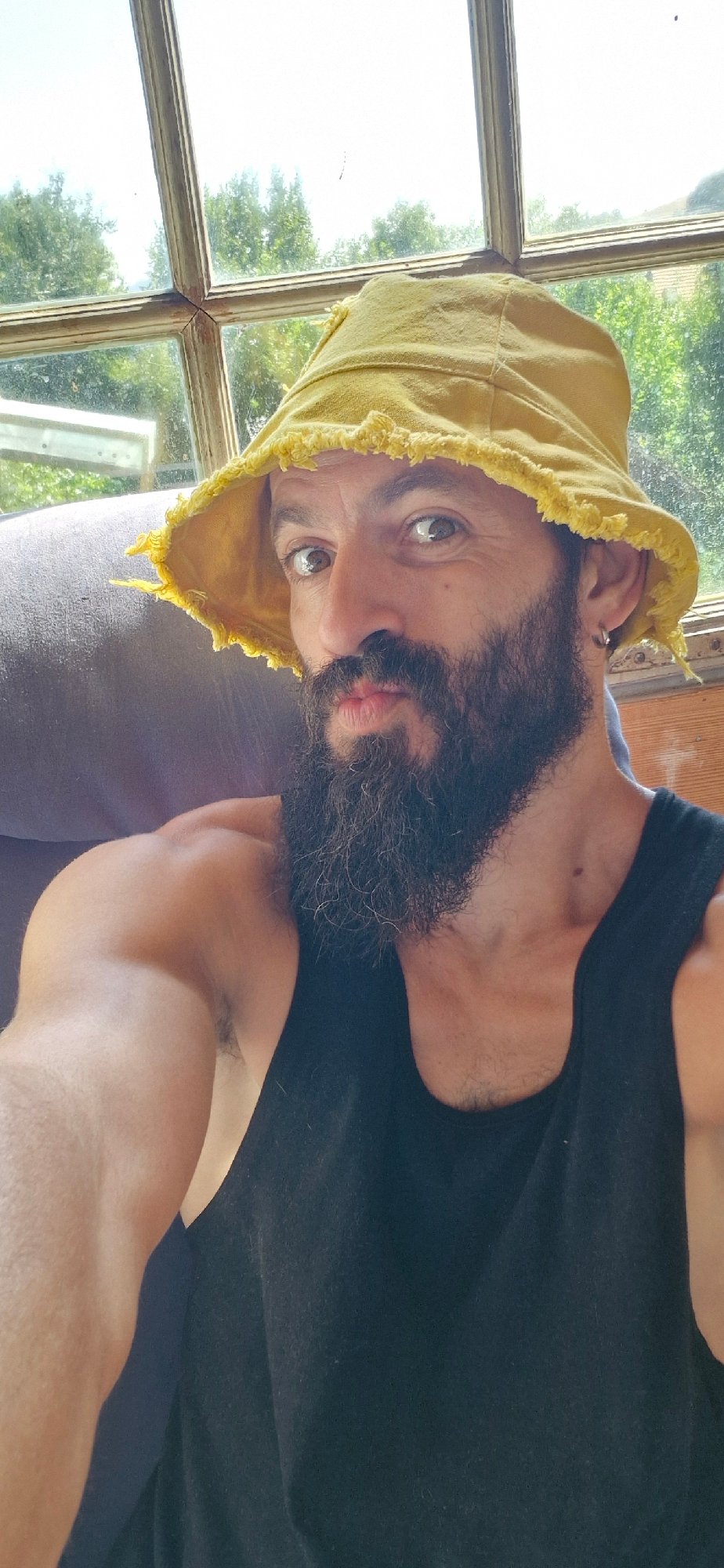Yellow bucket hat selfie session in sunny Wattenwil, Switzerland