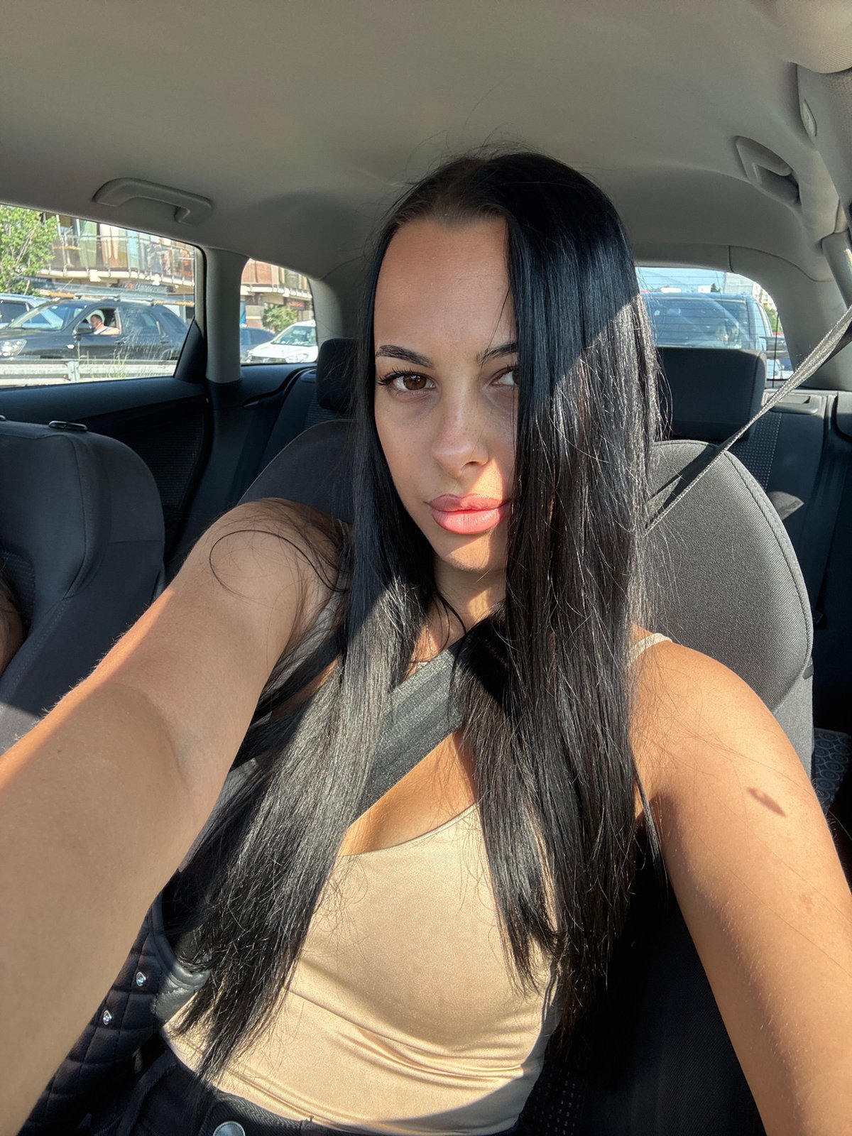 Passenger seat moment in a sunlit car, Varna