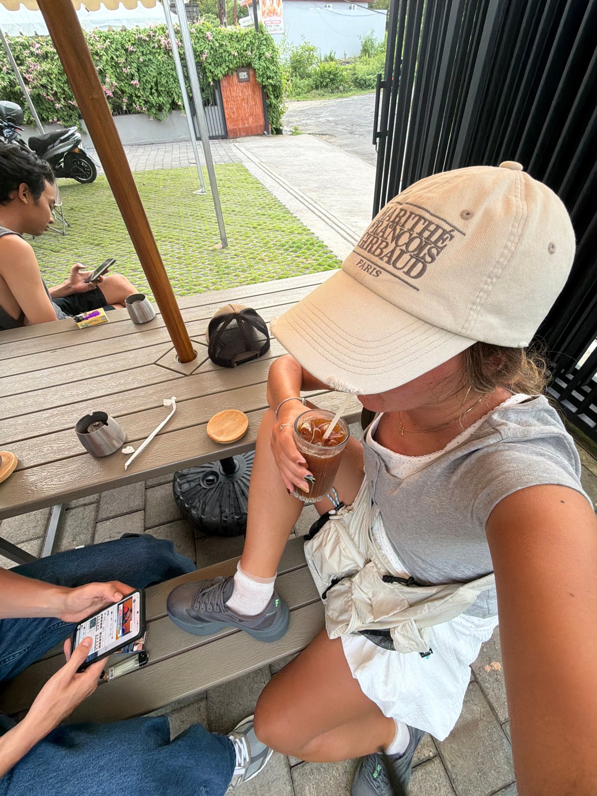 Two people sit at outdoor table in Kuta Selatan