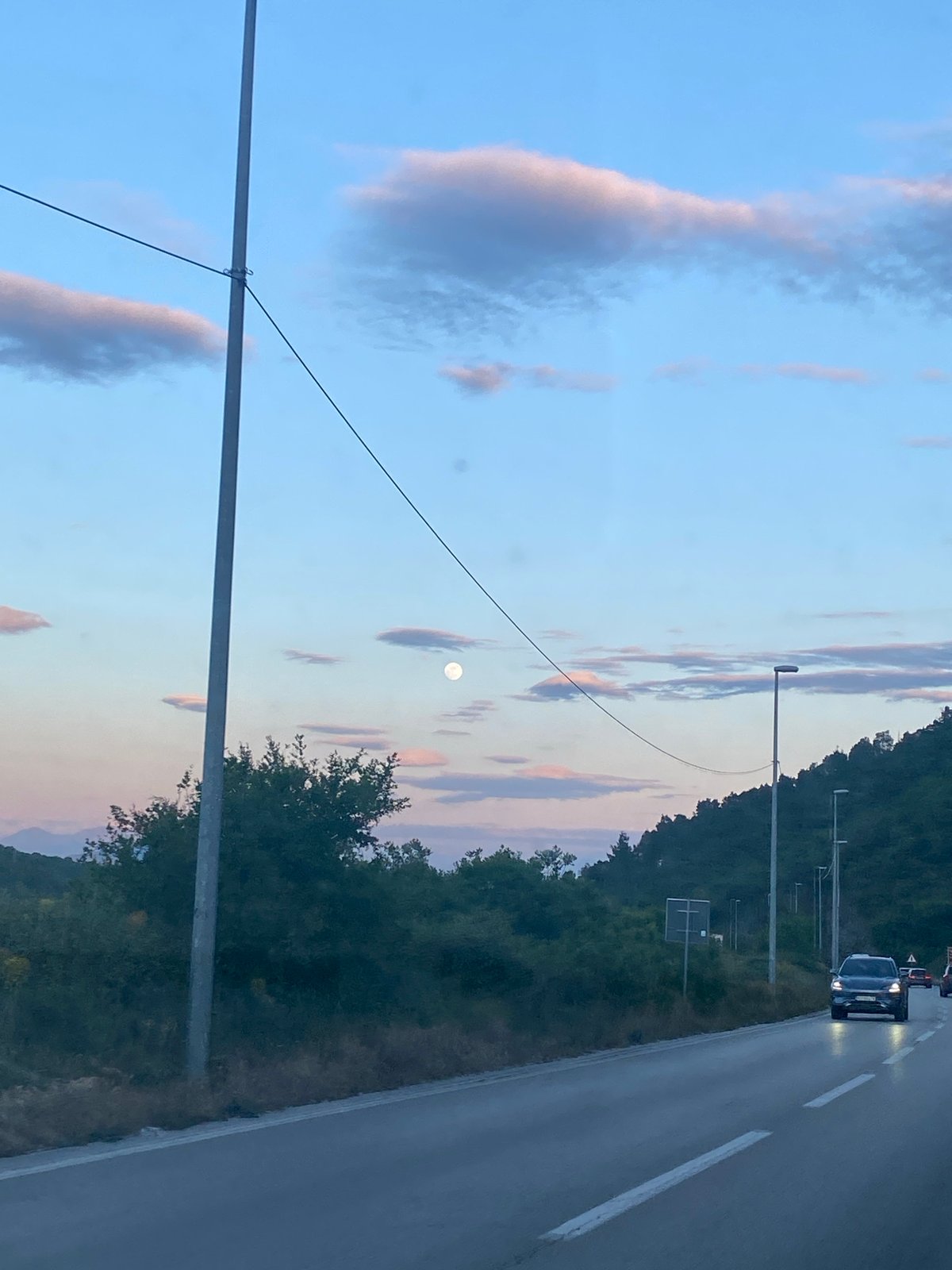 Twilight photograph captures evening sky with visible moon