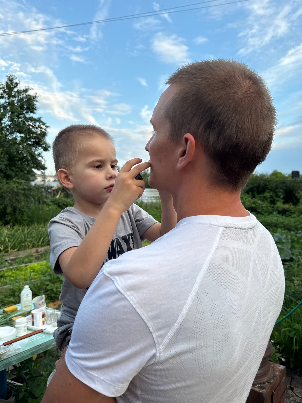 Casual outdoor gathering in Chaikovsky on a summer afternoon